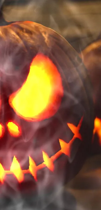 Eerie glowing pumpkin wallpaper with smoke effects.