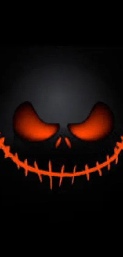 Spooky, grinning face with orange eyes on a black background mobile wallpaper.