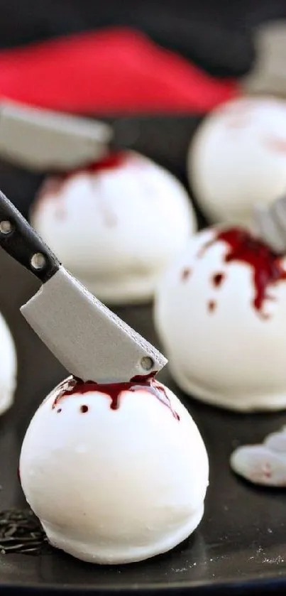 Halloween cake pops with mini cleaver decorations.