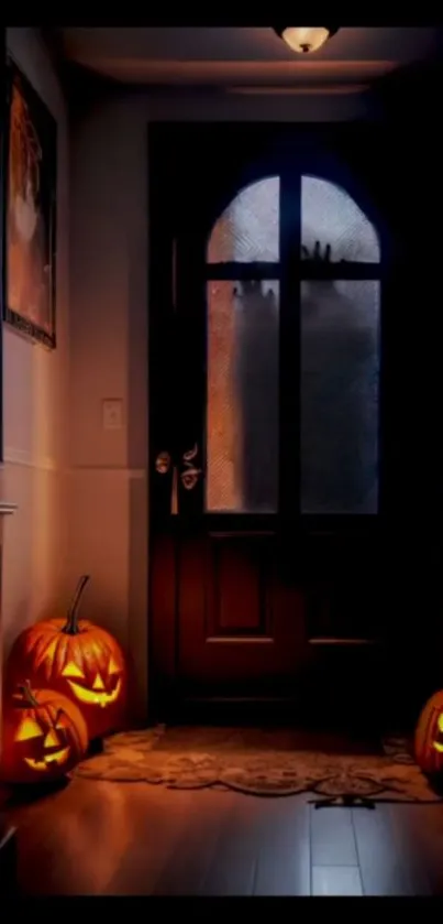 Spooky entryway with glowing pumpkins for Halloween night.