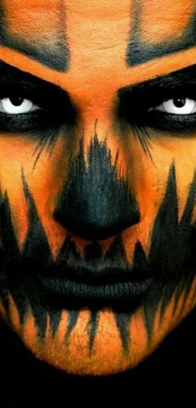 Striking face art with Halloween theme in orange and black colors for mobile wallpaper.