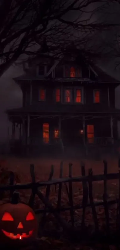 A haunted house with glowing windows and a carved pumpkin for Halloween night.