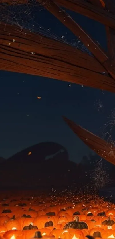 Halloween night scene with glowing pumpkins under a wooden structure.