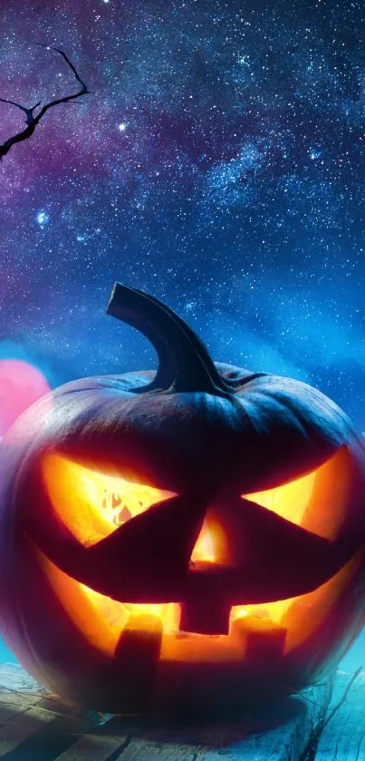 Halloween wallpaper with a jack-o'-lantern under a starry blue night sky.