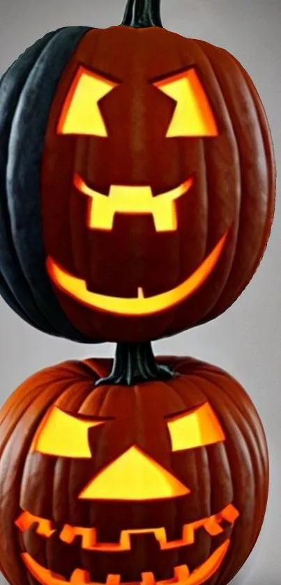 Stacked glowing Jack-o'-lanterns Halloween wallpaper.