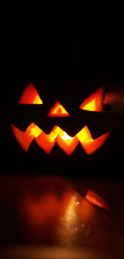 Glowing carved pumpkin with an eerie Halloween vibe on a dark background.