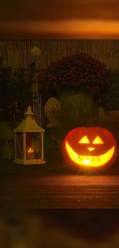 Halloween pumpkin with glowing face next to lantern and flowers.