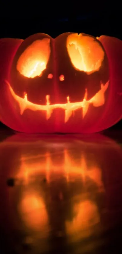 Glowing carved pumpkin with spooky face, perfect for Halloween.