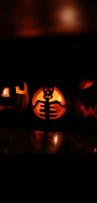 Eerie Halloween pumpkins glowing in the dark, set against a black background.