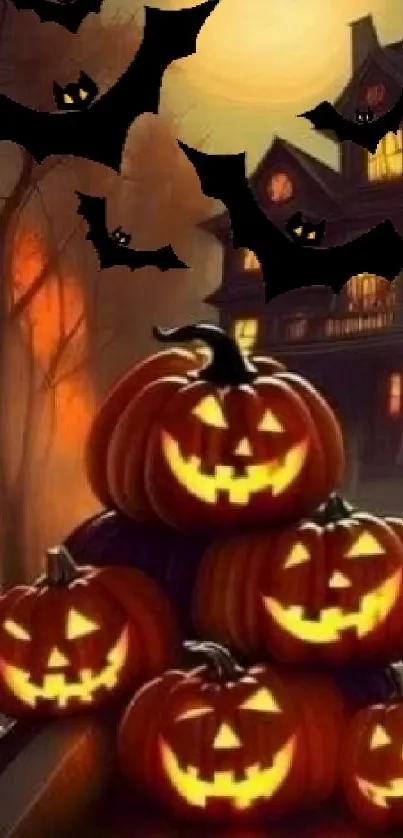 Halloween wallpaper with pumpkins, bats, and a haunted house in the background.