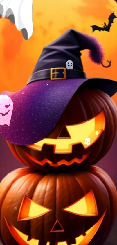 Halloween wallpaper with pumpkins, hat, and spooky moon.