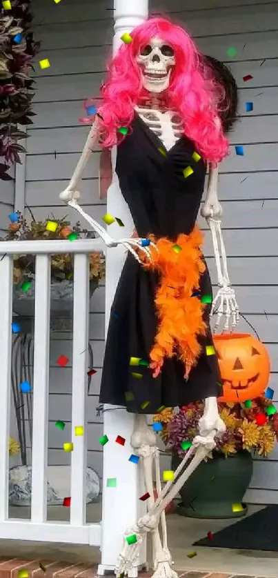 Skeleton Halloween decor with pink hair and pumpkin.