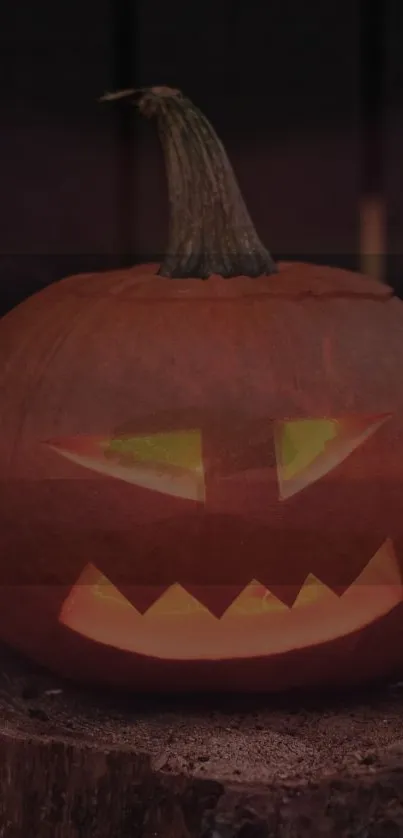 Spooky glowing jack-o'-lantern on dark background for Halloween.