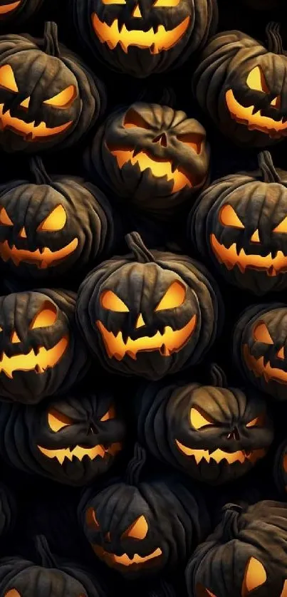 Mobile wallpaper with glowing jack-o'-lanterns on a dark background.