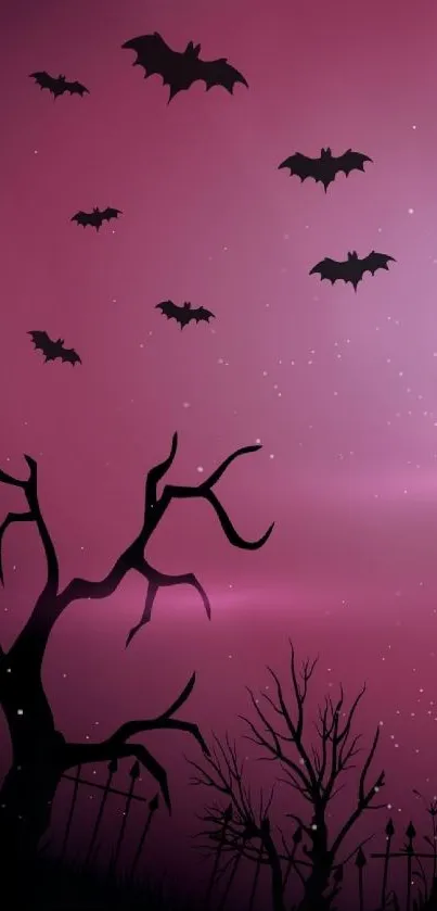 Silhouettes of bats flying against a purple night sky with bare trees.