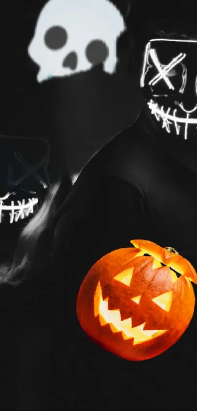 Halloween wallpaper with glowing masks and a carved pumpkin.