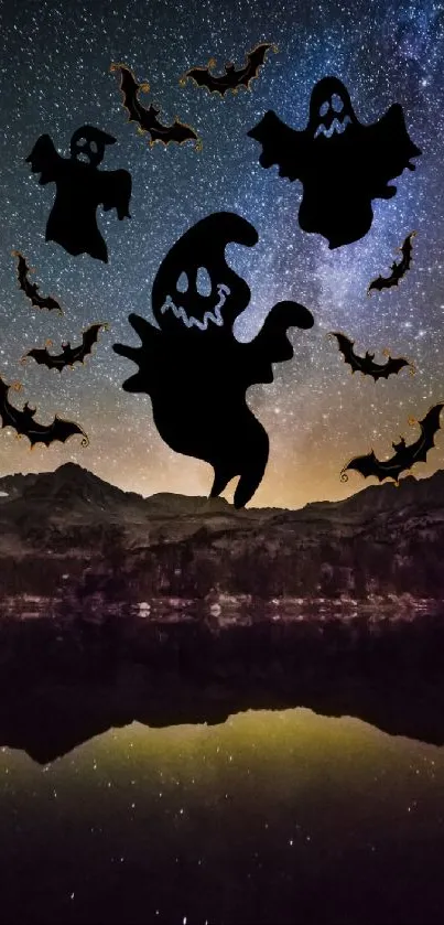 Night sky with ghosts and bats over a mountain landscape.