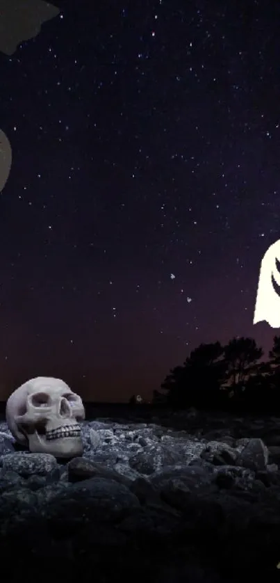 Spooky scene with skull under a starry night sky on a mobile wallpaper.
