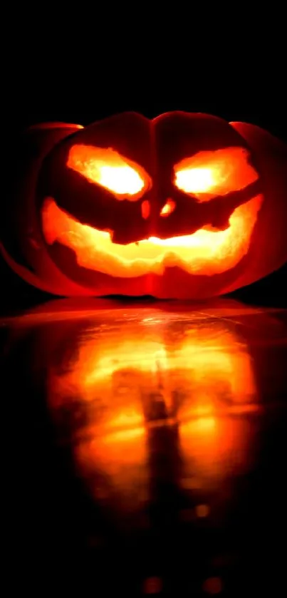 Glowing jack-o'-lantern on a dark background.