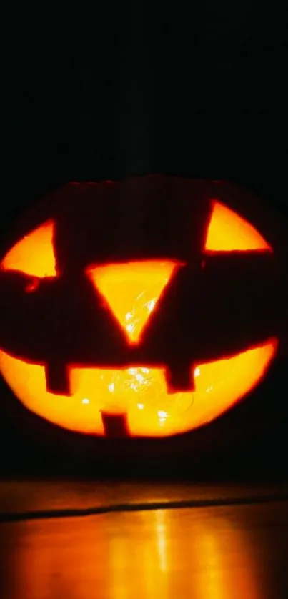 Glowing pumpkin on a dark background, perfect for Halloween.