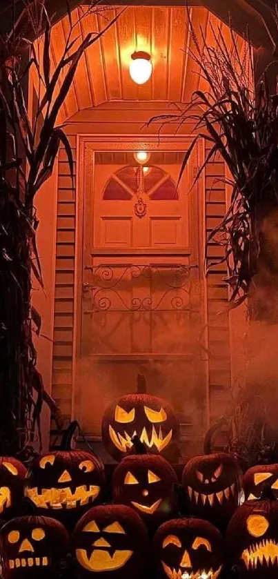 Spooky porch with carved pumpkins glowing at night.