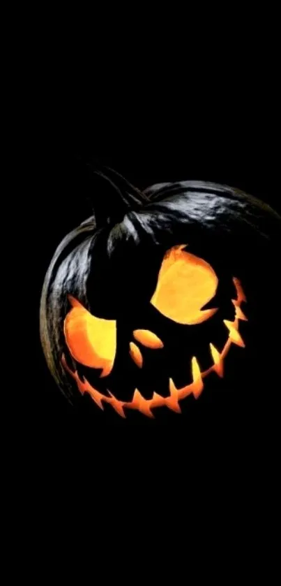 Spooky glowing jack-o'-lantern on a black background.