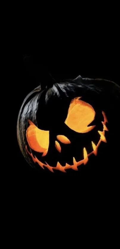 A spooky Halloween pumpkin with a glowing face against a dark background.