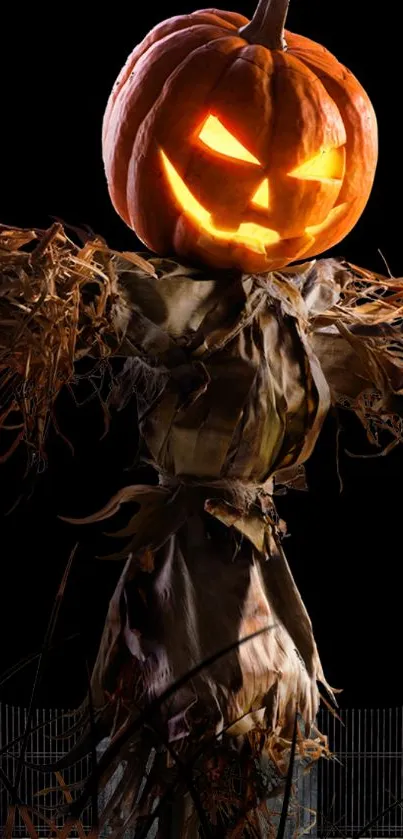 Eerie pumpkin scarecrow with a glowing face in the dark night.