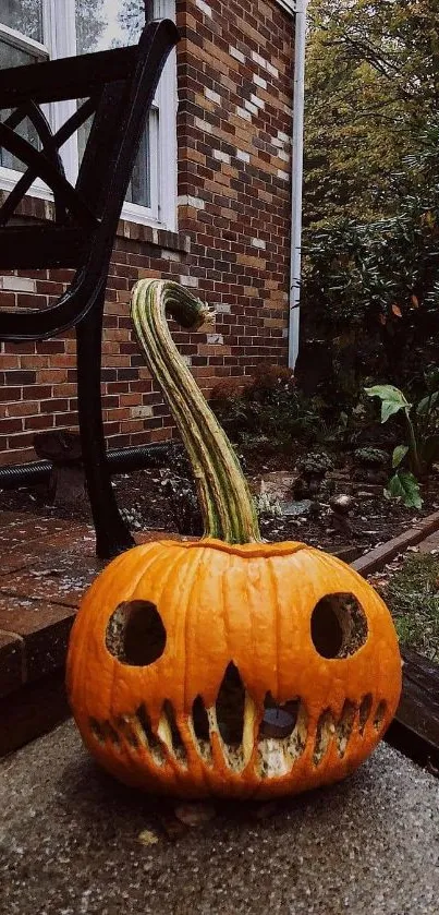 Carved pumpkin with spooky face in yard setting.