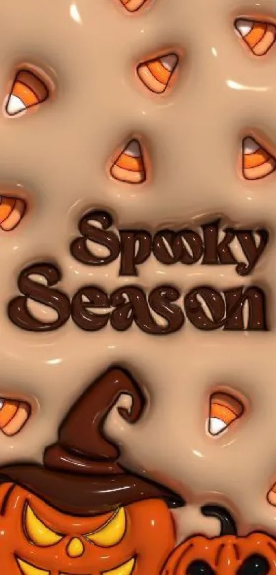 Halloween-themed wallpaper with pumpkins and candy corn.