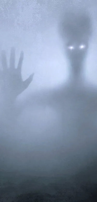 Spooky shadow figure with glowing eyes in foggy background.