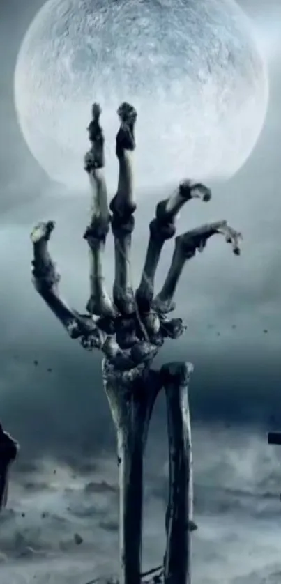 Skeleton hand reaches up in moonlit graveyard under a cloudy sky.