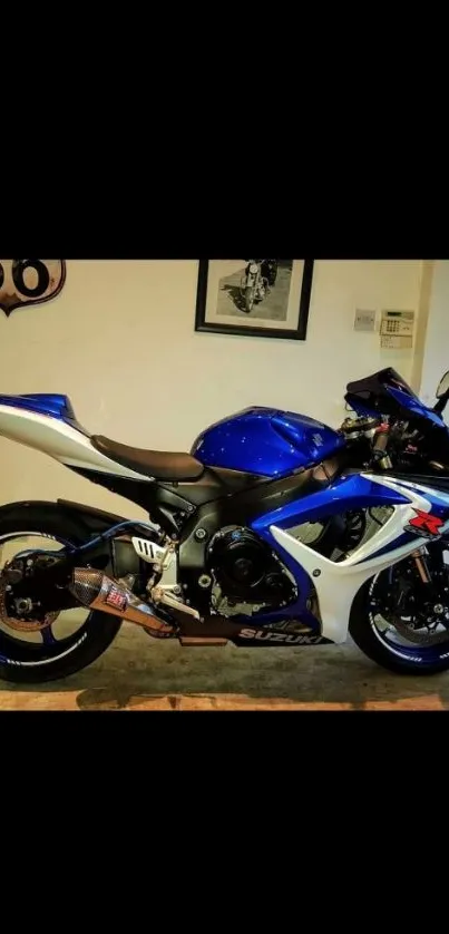 Sleek blue sports motorcycle parked indoors.