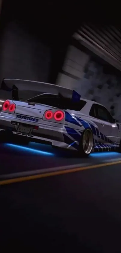 Sport car drifting in a tunnel at night with glowing taillights.