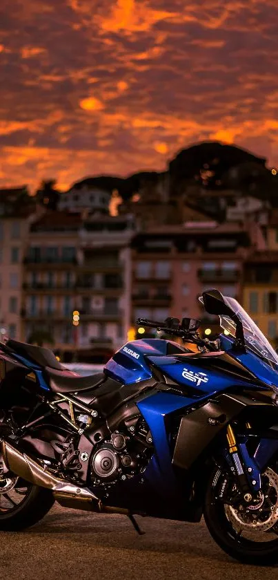 Blue sportbike with city and sunset scene on wallpaper.