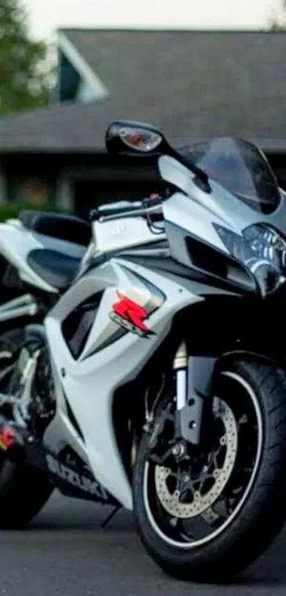 Sleek sportbike parked in an urban driveway scene, showcasing power and design.