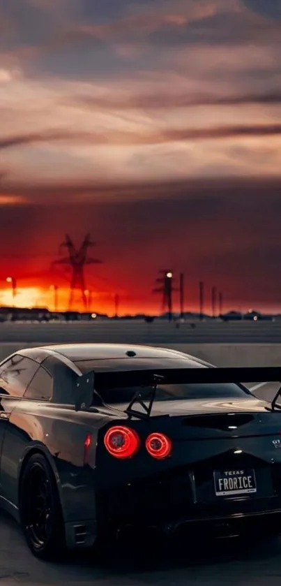 Sleek sports car with sunset backdrop.