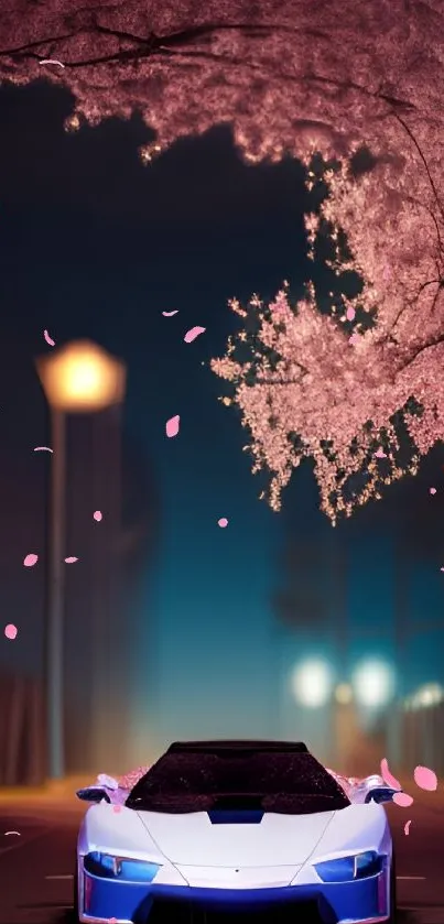 Sportscar under cherry blossoms at night.