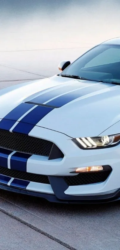 Sleek blue racing car with stripes wallpaper.