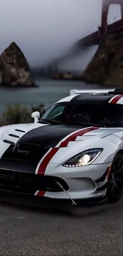 White sports car on scenic road with river and bridge background.