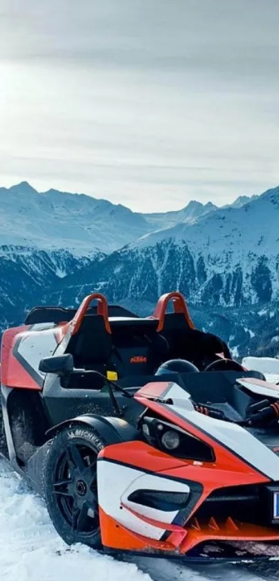 Orange sports car parked in snowy mountain landscape under a clear sky.