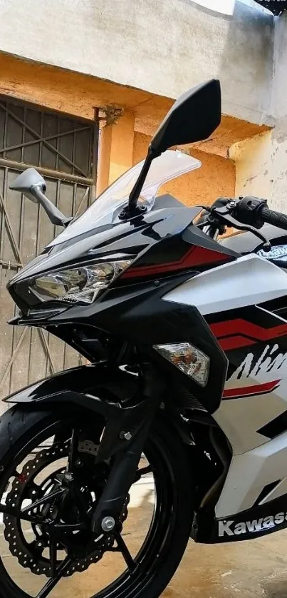 Close-up of a sporty black motorcycle in an urban setting.