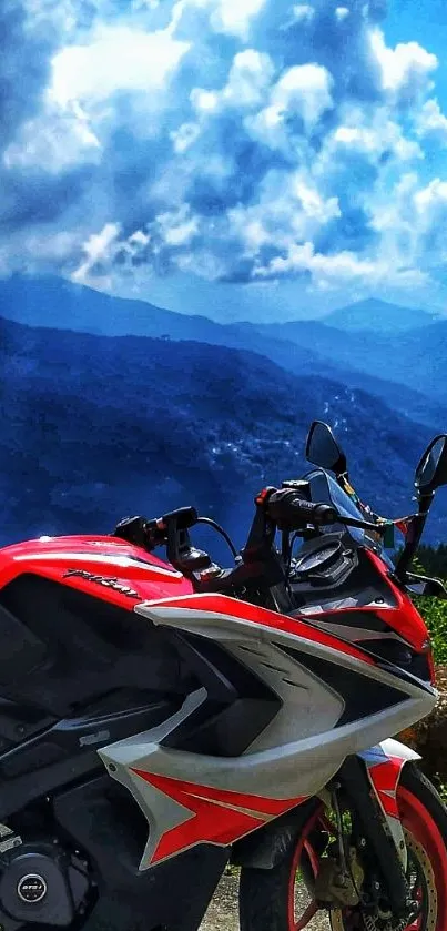 Red sport motorcycle with scenic sky and mountain backdrop.