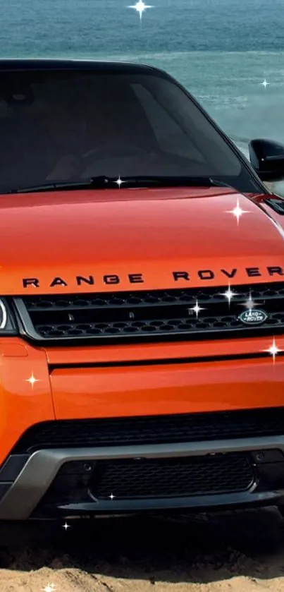 Orange Range Rover parked on a beach.