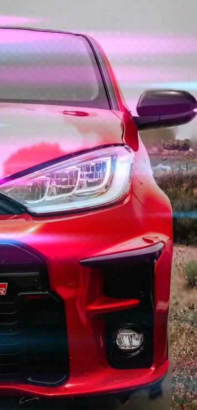 Sporty red car with neon lights in scenic background.