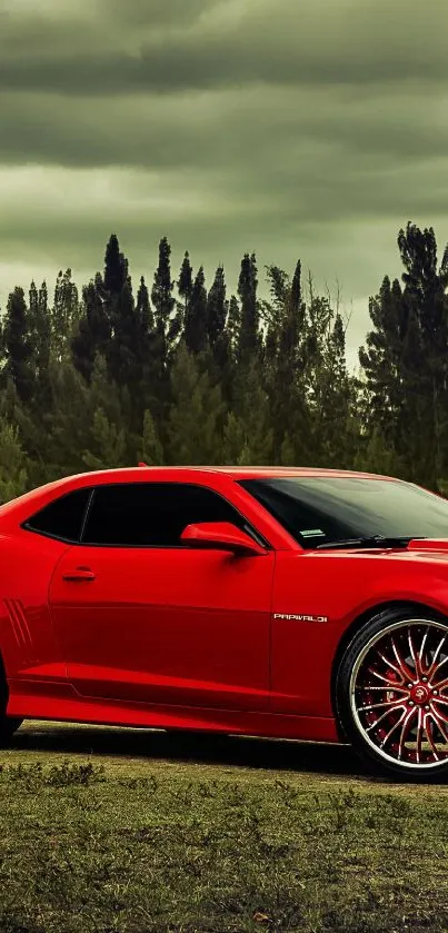 Red sports car against forest backdrop mobile wallpaper.