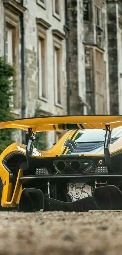 Sleek yellow sports car in urban setting.