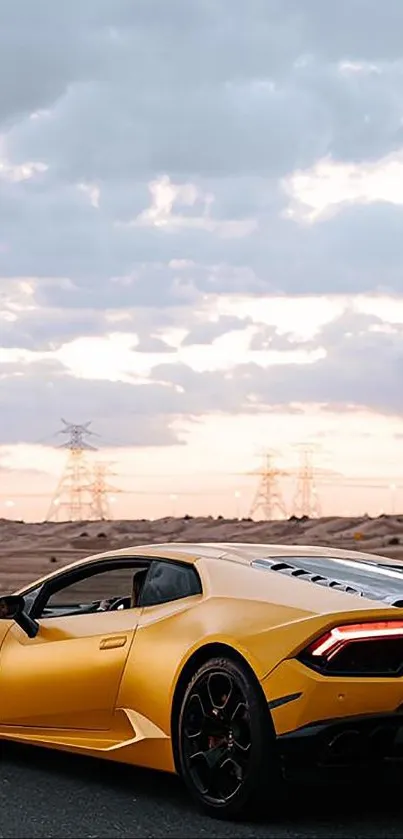 Yellow sports car driving on a desert road under a cloudy sky.