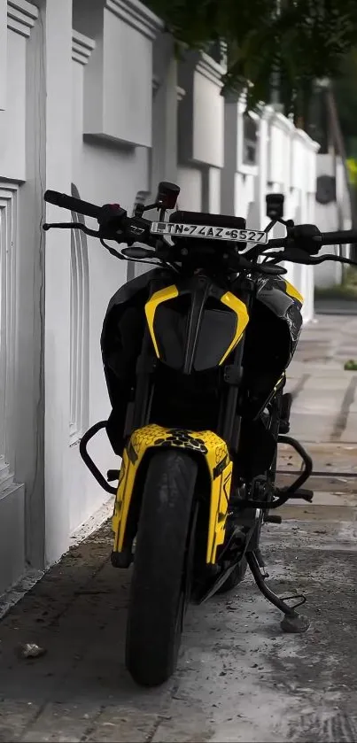 Yellow motorcycle parked on urban street.