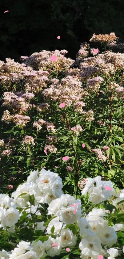 Lush garden with white and pink flowers in vibrant green landscape.